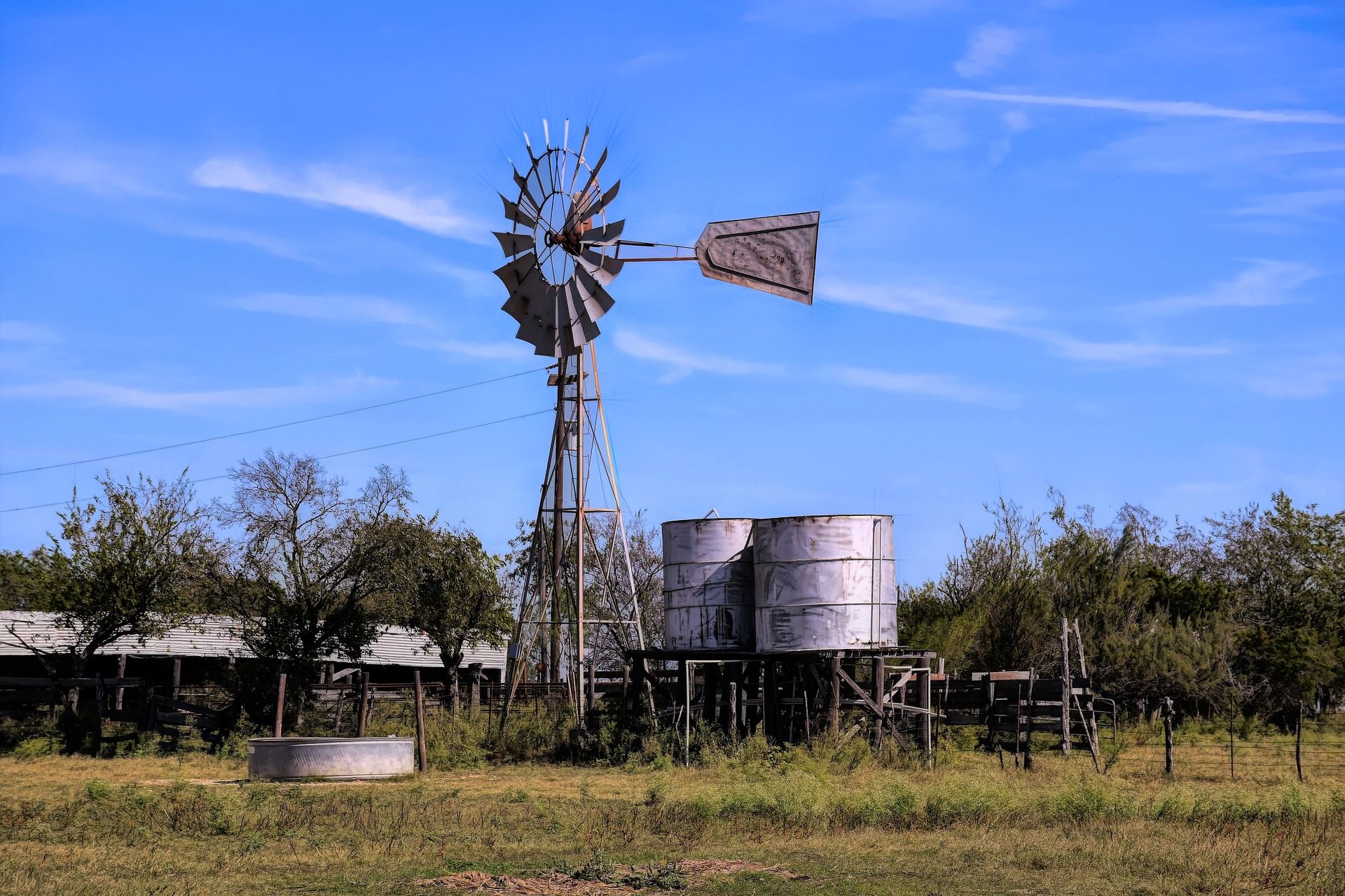 windmill with water towers courtesy of Pixabay